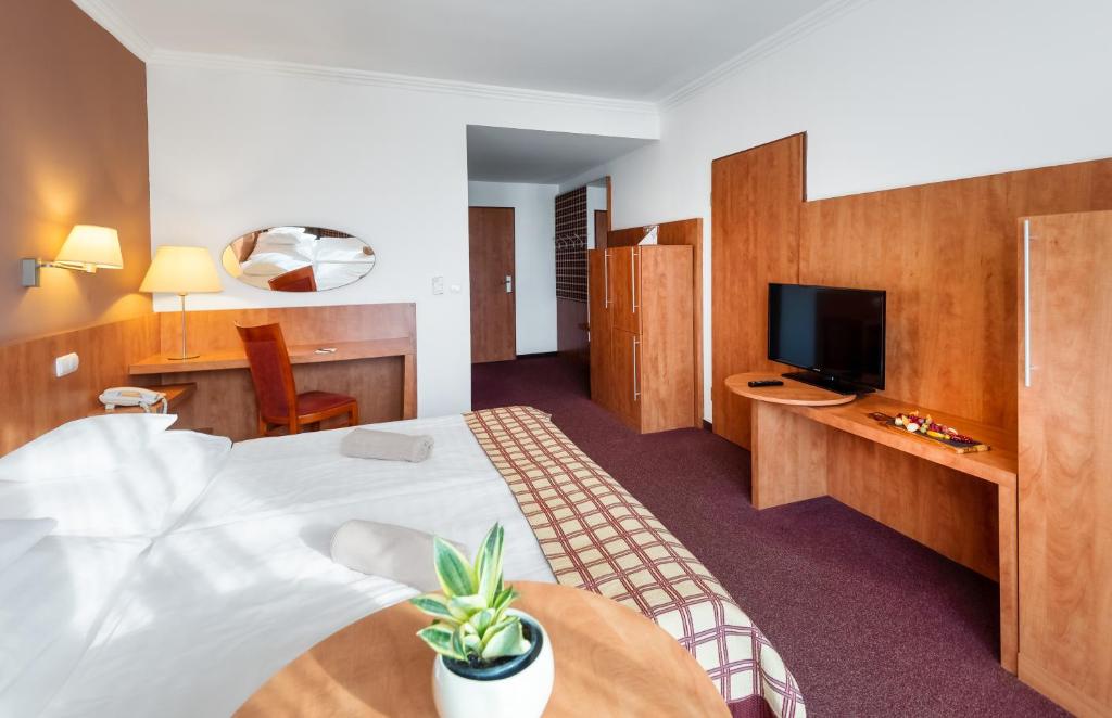 TV a/nebo společenská místnost v ubytování Hunguest Hotel Pelion