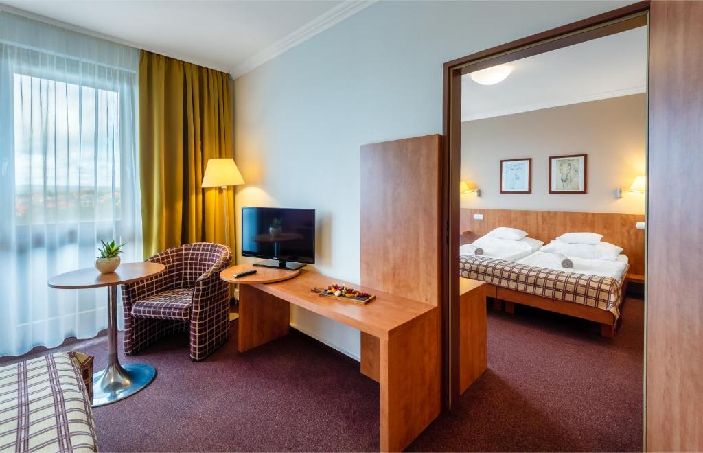 Postel nebo postele na pokoji v ubytování Hunguest Hotel Pelion
