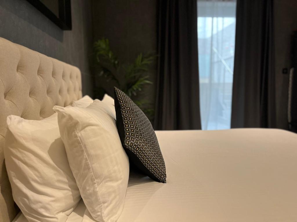 Postel nebo postele na pokoji v ubytování Sliema Studios