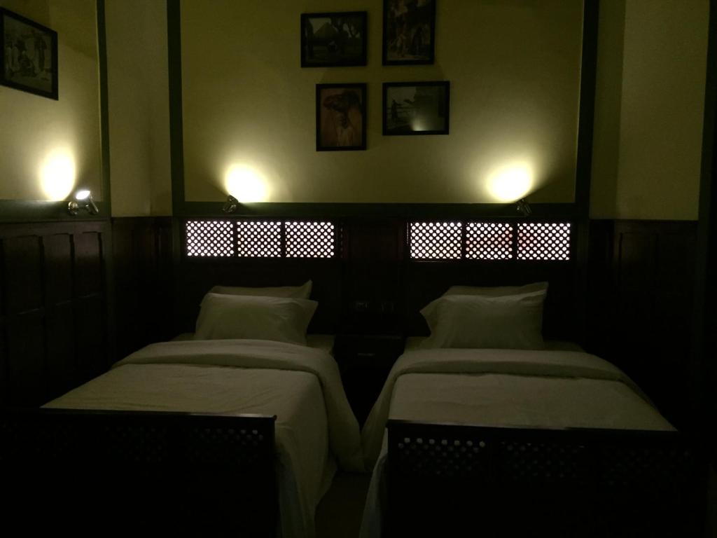 Postel nebo postele na pokoji v ubytování Carlton Downtown Cairo