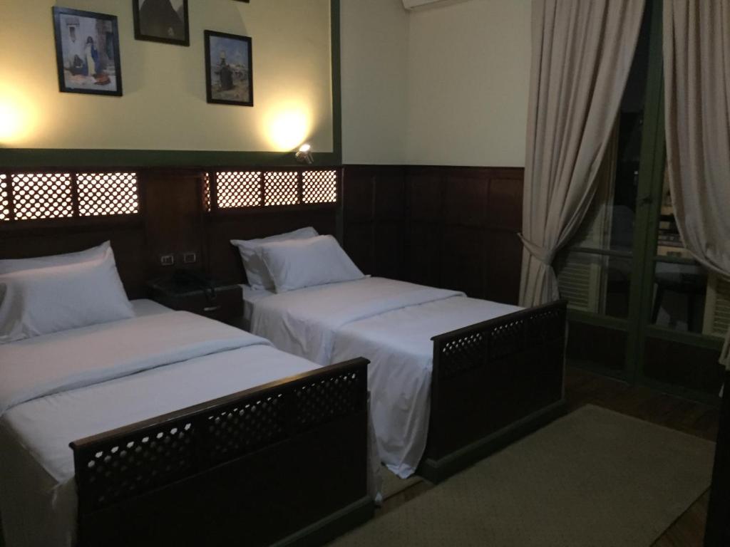 Postel nebo postele na pokoji v ubytování Carlton Downtown Cairo