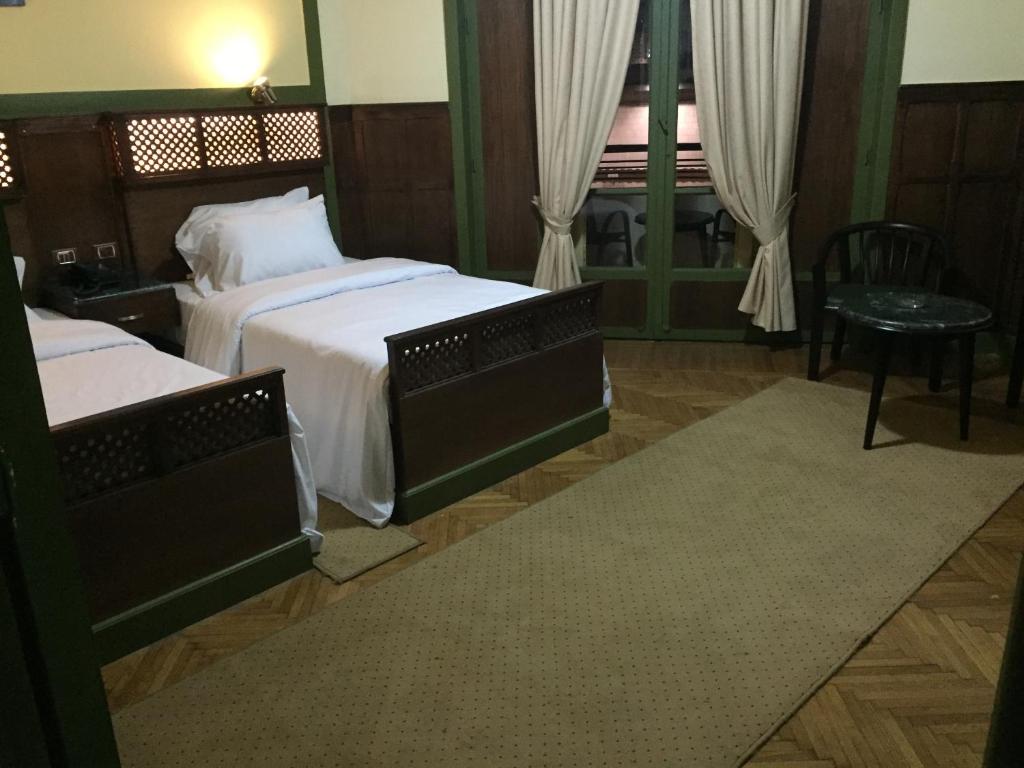 Postel nebo postele na pokoji v ubytování Carlton Downtown Cairo