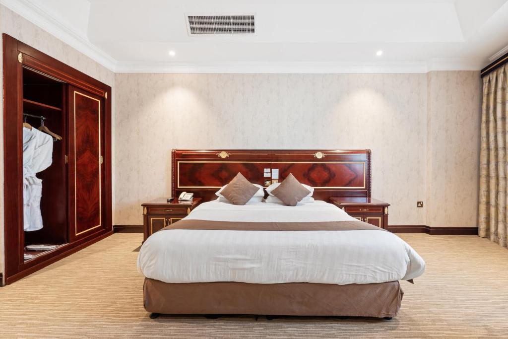 Krevet ili kreveti u jedinici u okviru objekta Chairmen Hotel