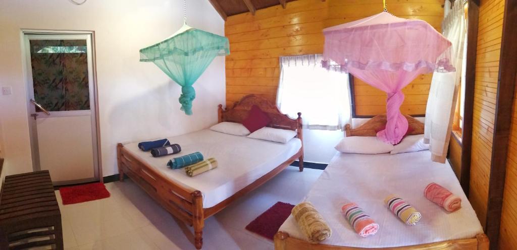 Postel nebo postele na pokoji v ubytování DOT BEY beach cabana