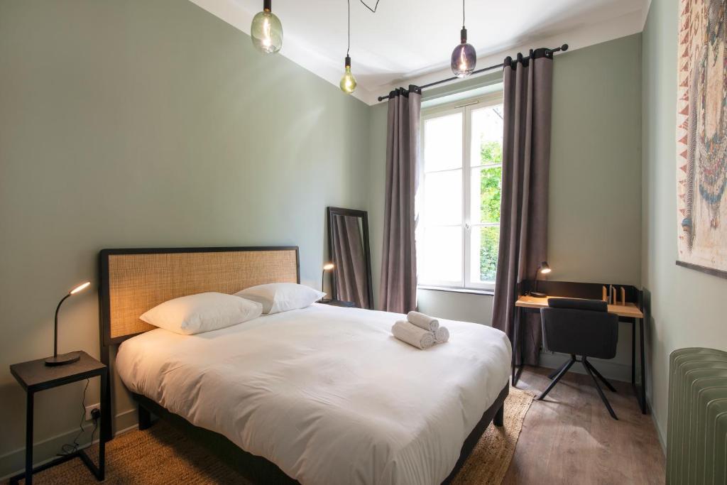 Кровать или кровати в номере Le Raffine de Lyautey avec parking prive