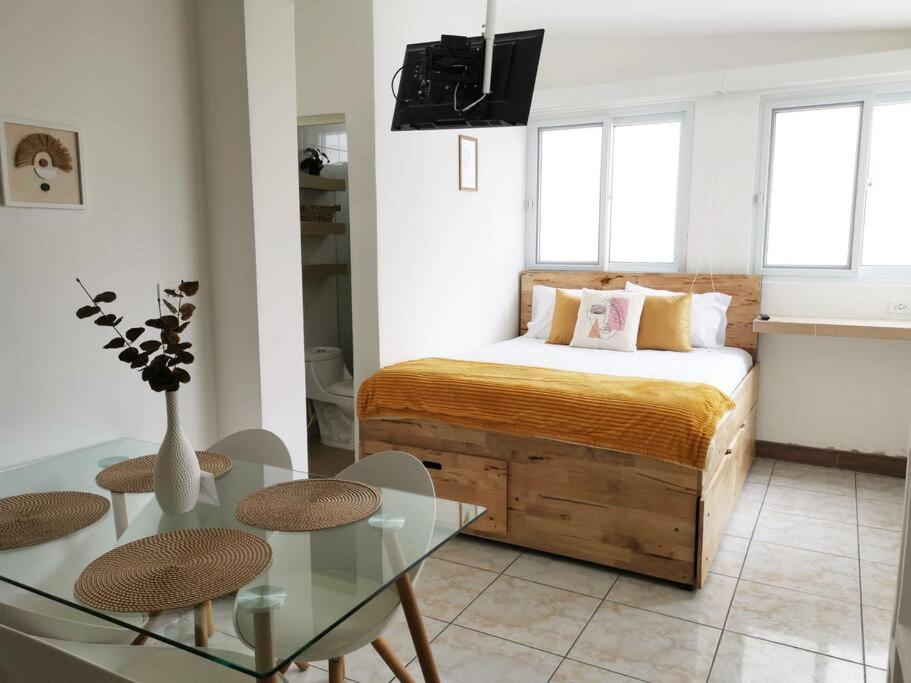 Ein Bett oder Betten in einem Zimmer der Unterkunft Precioso Apartamento D