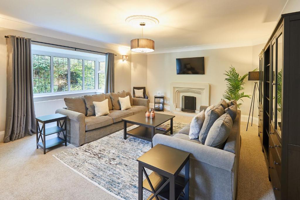 a living room with two couches and a fireplace at Host & Stay - White Lodge in Scalby