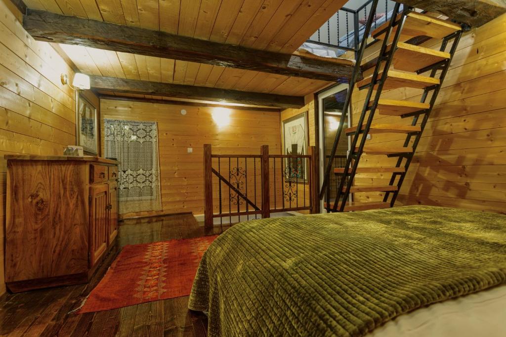 Giường trong phòng chung tại Zlatibor Cottages