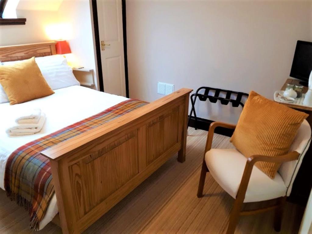 Postel nebo postele na pokoji v ubytování Corsewall Arms Guest House