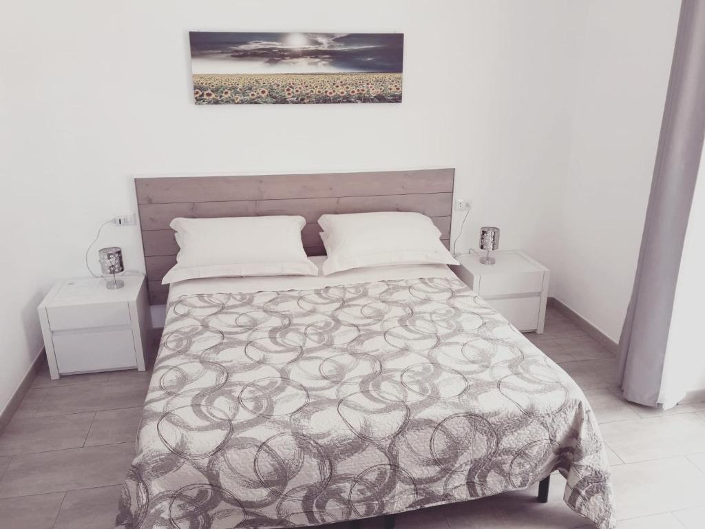 Posteľ alebo postele v izbe v ubytovaní un passo dal mare
