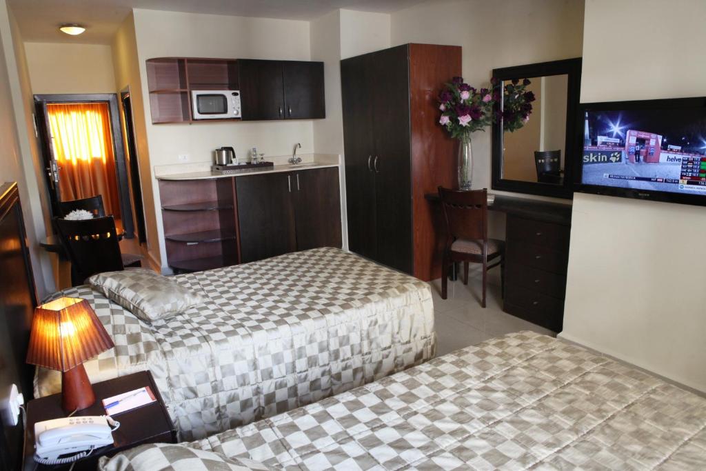 Postel nebo postele na pokoji v ubytování Mozart Hotel