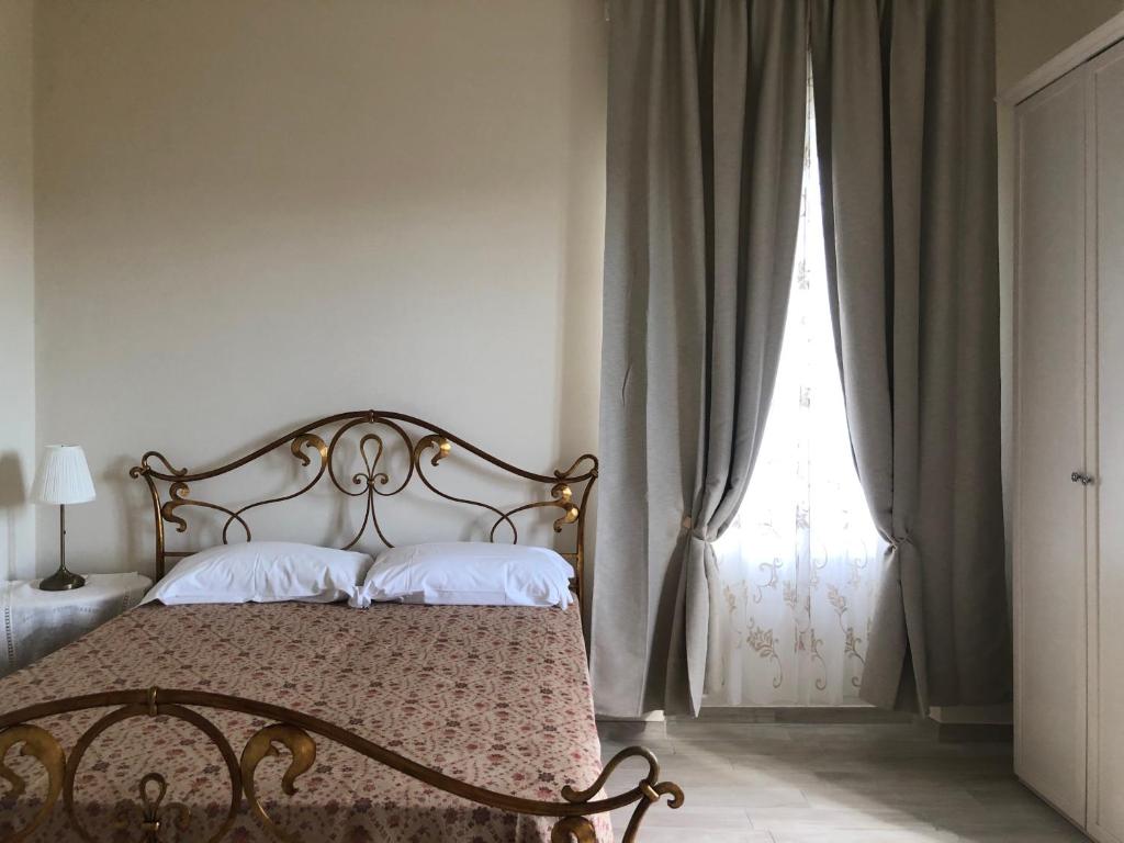 מיטה או מיטות בחדר ב-Podere Maison Délices