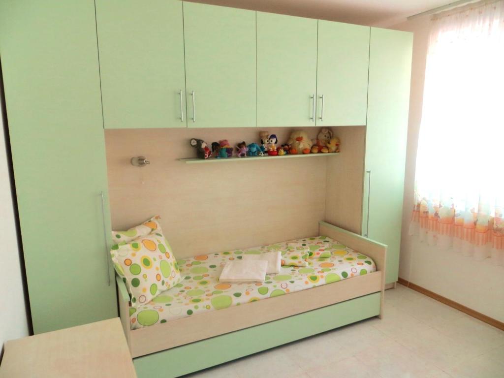 A bed or beds in a room at Holiday Apartment in Riviera Complex
