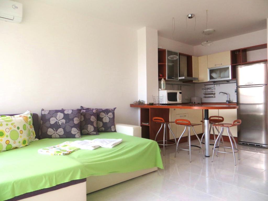 A kitchen or kitchenette at Holiday Apartment in Riviera Complex