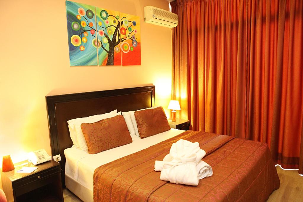 Postel nebo postele na pokoji v ubytování Mozart Hotel