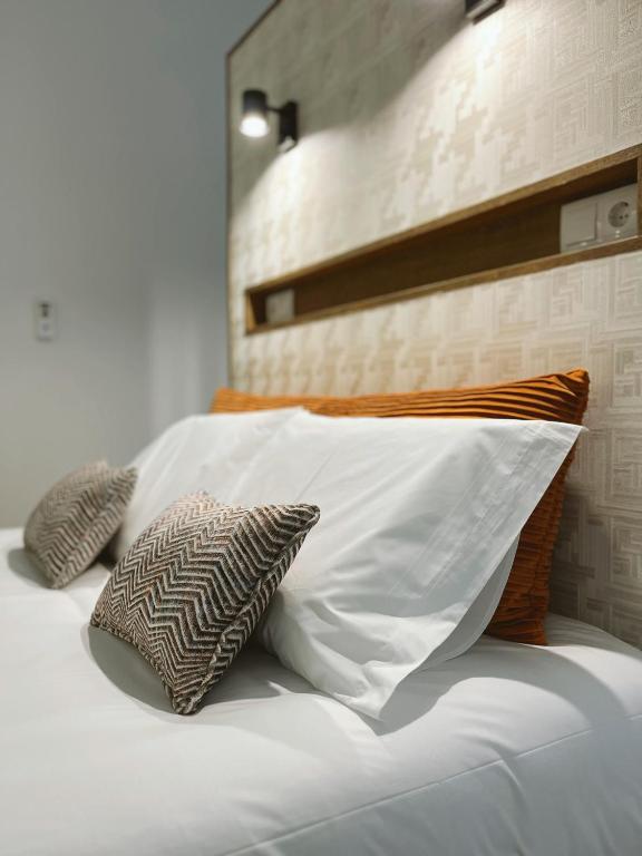 Postel nebo postele na pokoji v ubytování Alto do Ferrum - Boutique Villa