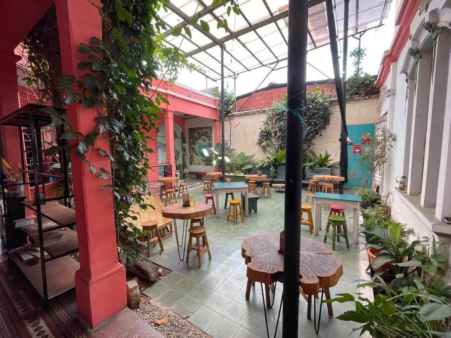 a patio with tables and chairs in a building at Mini Loft 2 en El CIrculo in Guatemala