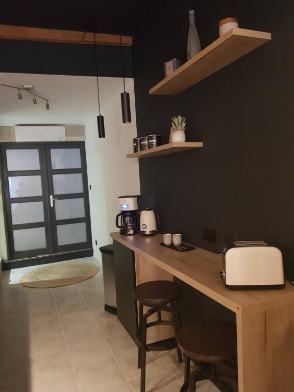 Kuchyňa alebo kuchynka v ubytovaní le J&J Appartement spacieux climatisé en centre ville