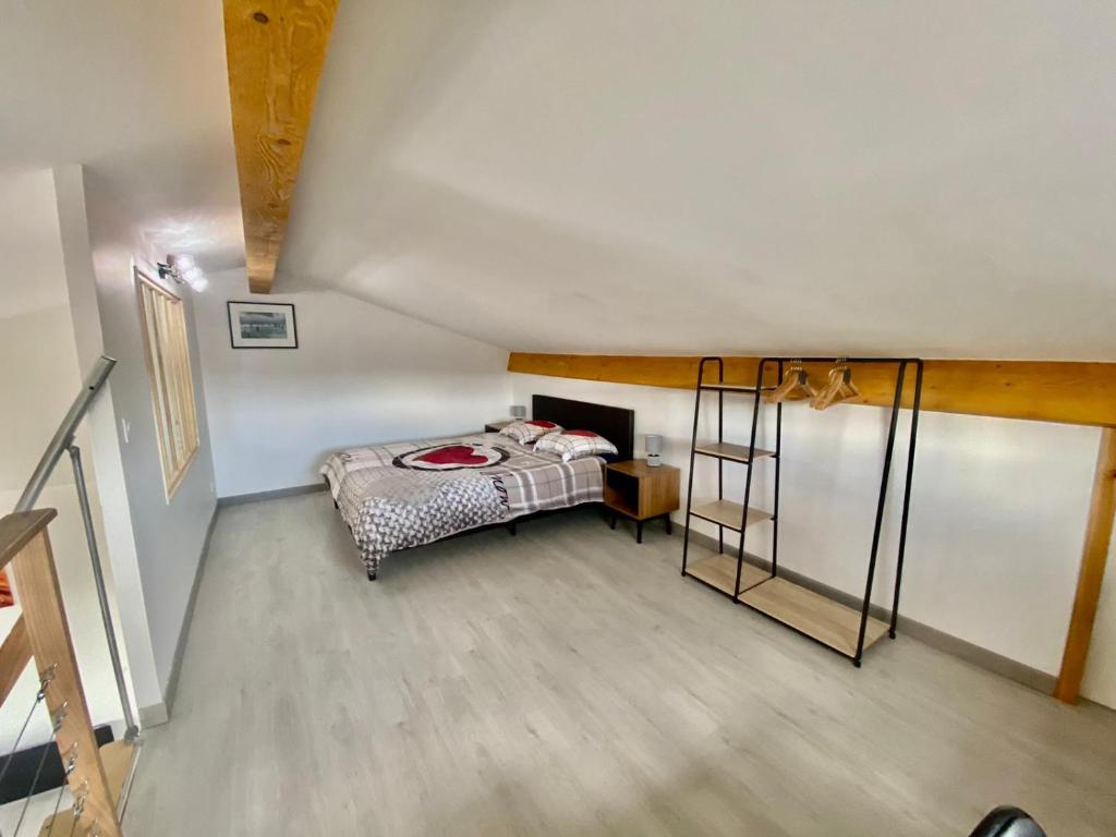 Postel nebo postele na pokoji v ubytování l’Aragonette
