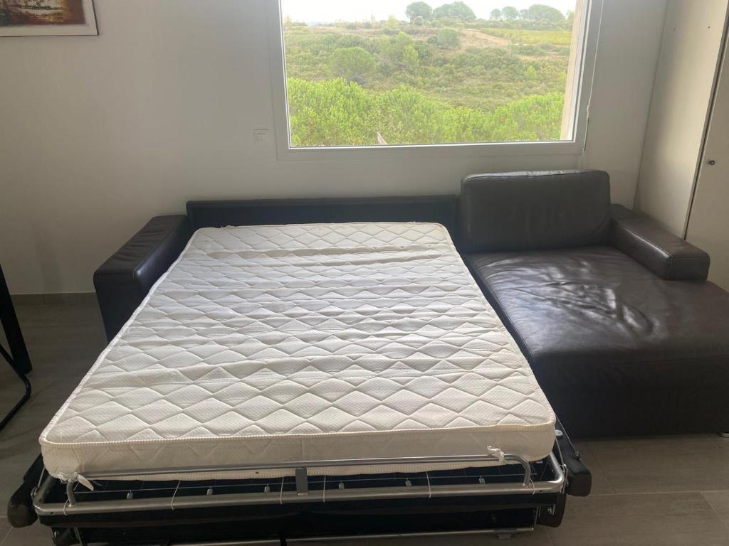 Postel nebo postele na pokoji v ubytování l’Aragonette