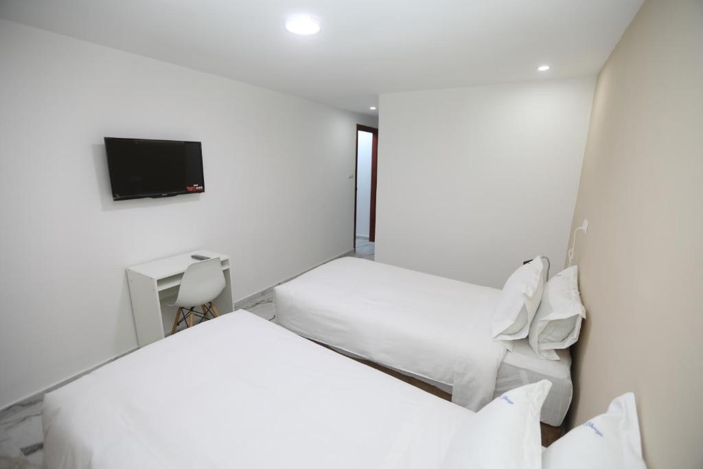 Una cama o camas en una habitación de MJI GROUP