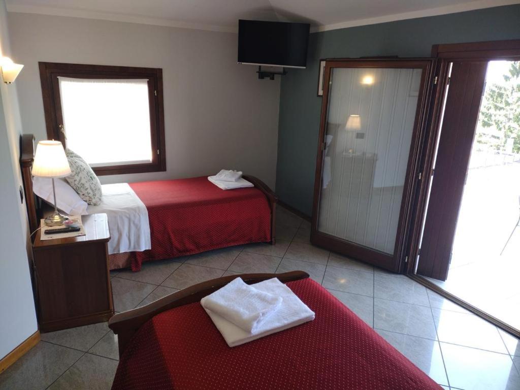 Posteľ alebo postele v izbe v ubytovaní Hotel Ristorante Regina
