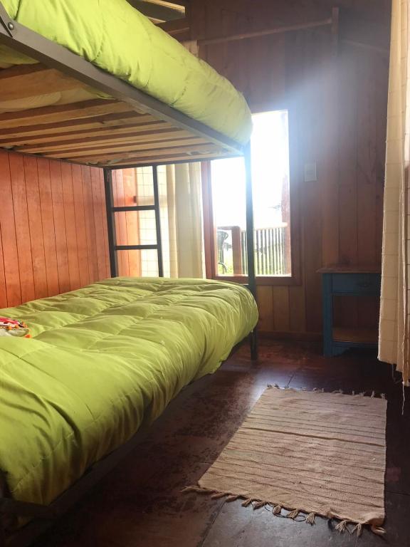 Uma cama ou camas num quarto em Hostel Raíz