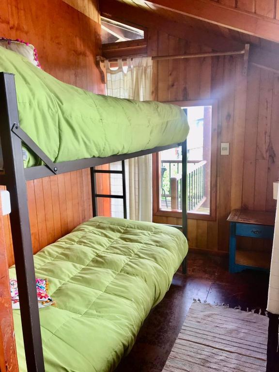 Uma cama ou camas num quarto em Hostel Raíz