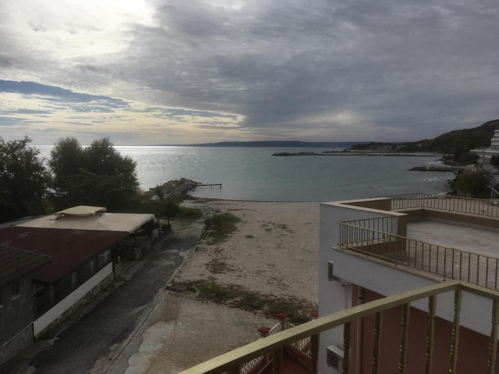 a view of a body of water from a balcony at Two-Bedroom Apartment with Sea View in Kavarna