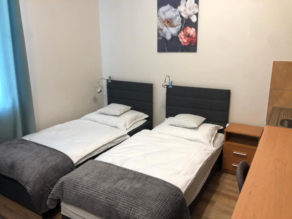 Posteľ alebo postele v izbe v ubytovaní Apartamenty JN Poznań Rzeczna 4
