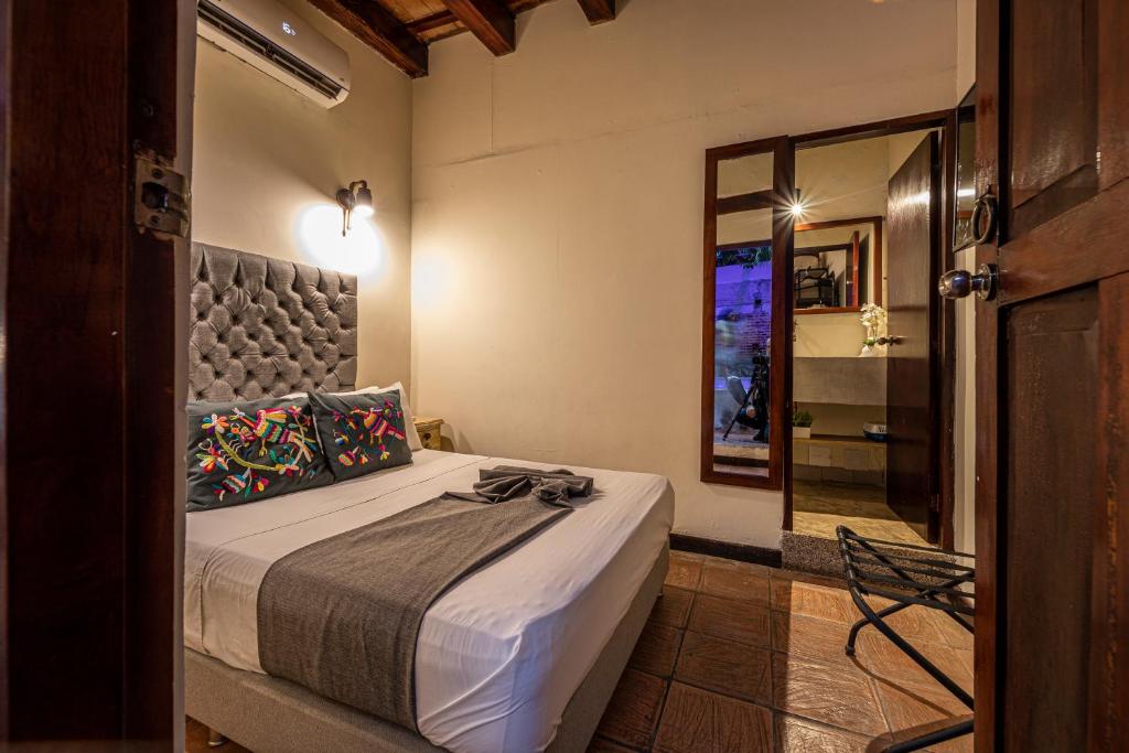 Postel nebo postele na pokoji v ubytování Casa Bugó Centro Histórico