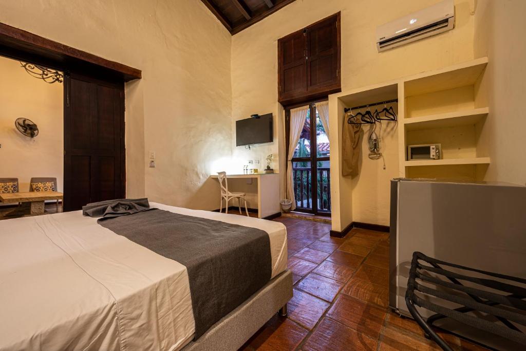 Postel nebo postele na pokoji v ubytování Casa Bugó Centro Histórico