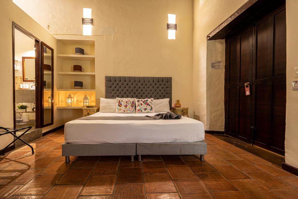 Postel nebo postele na pokoji v ubytování Casa Bugó Centro Histórico