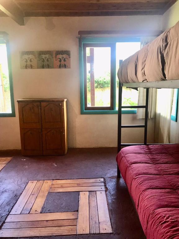 Uma cama ou camas num quarto em Hostel Raíz