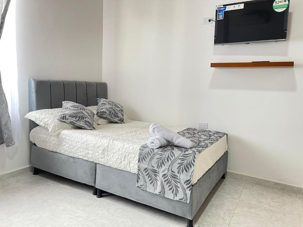 Postel nebo postele na pokoji v ubytování Casa Hotel Estelar