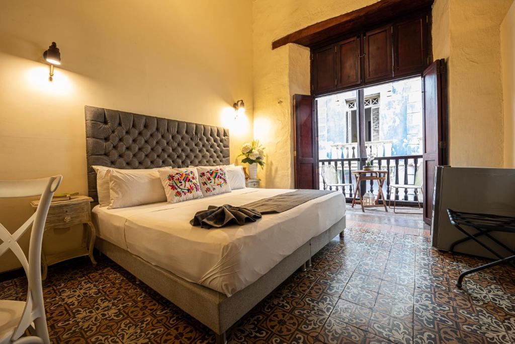Postel nebo postele na pokoji v ubytování Casa Bugó Centro Histórico