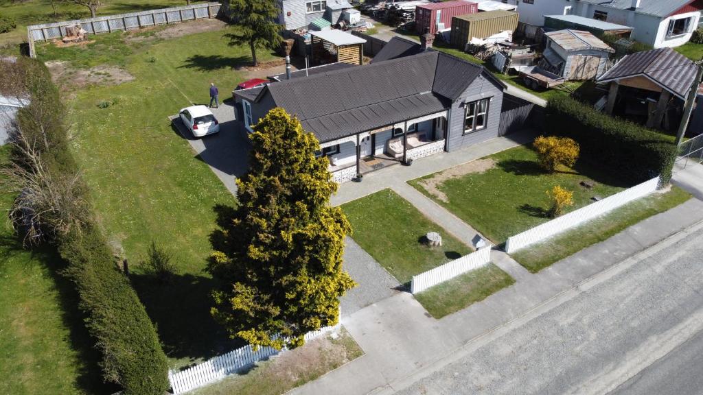 an aerial view of a house with a car parked in the driveway at The Old Forge - an "Heritage' house in Fairlie