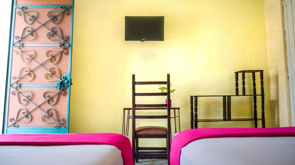 TV a/nebo společenská místnost v ubytování Hotel Mucuy