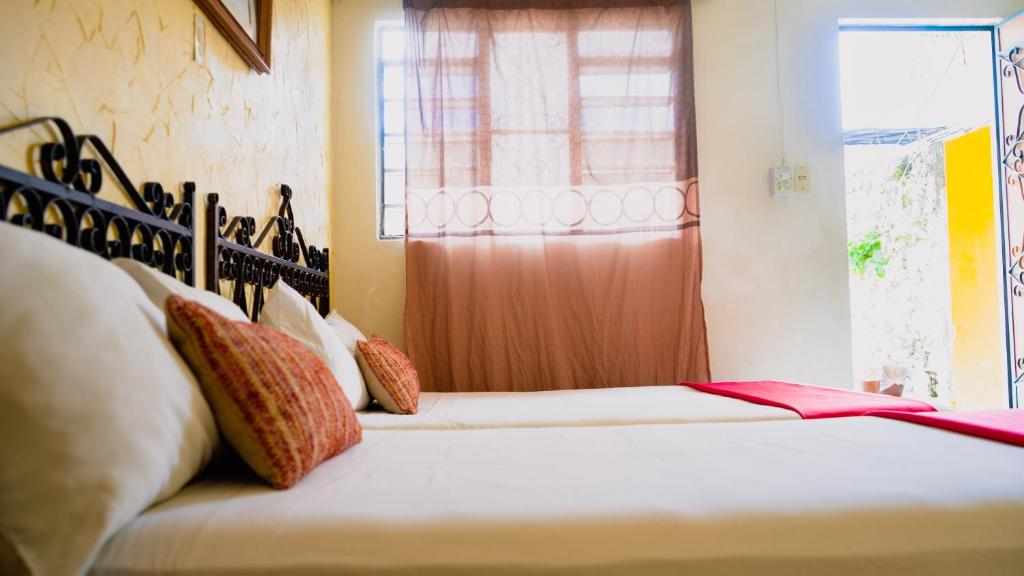Postel nebo postele na pokoji v ubytování Hotel Mucuy