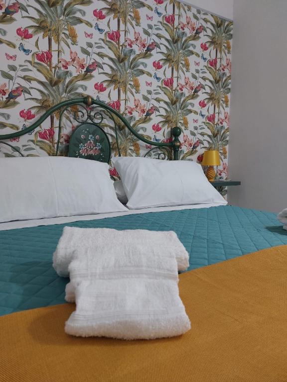 Łóżko lub łóżka w pokoju w obiekcie Casa TeKa