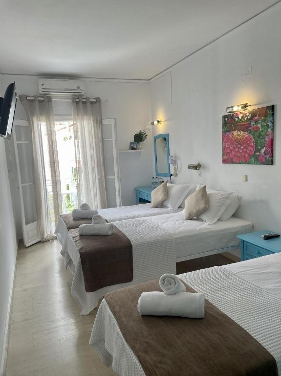 Postel nebo postele na pokoji v ubytování Stratos Hotel