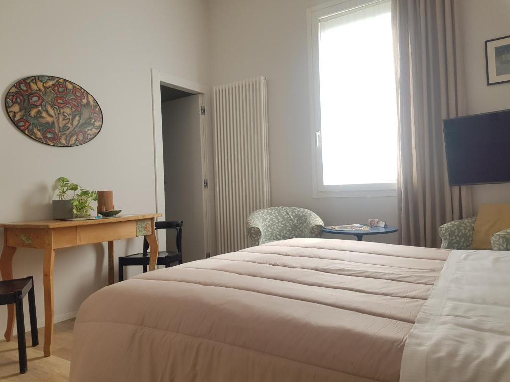 A bed or beds in a room at Nuova Porta dei Musicisti - Locazione Turistica