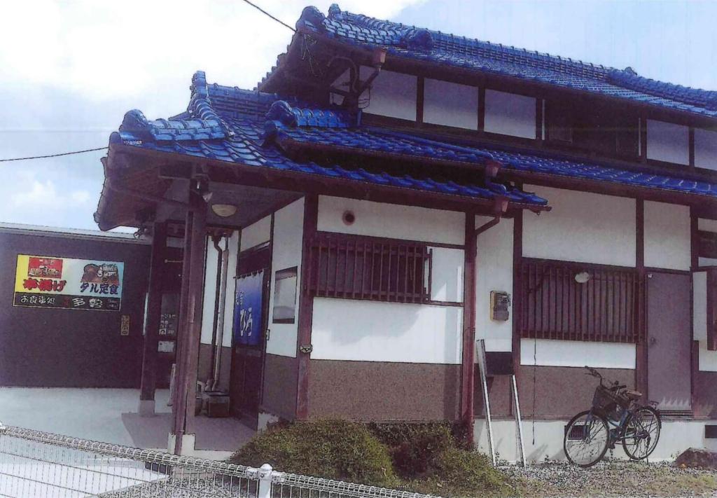 a building with a bike parked in front of it at Minshuku Hiro - Vacation STAY 84405v in Kami Amakusa