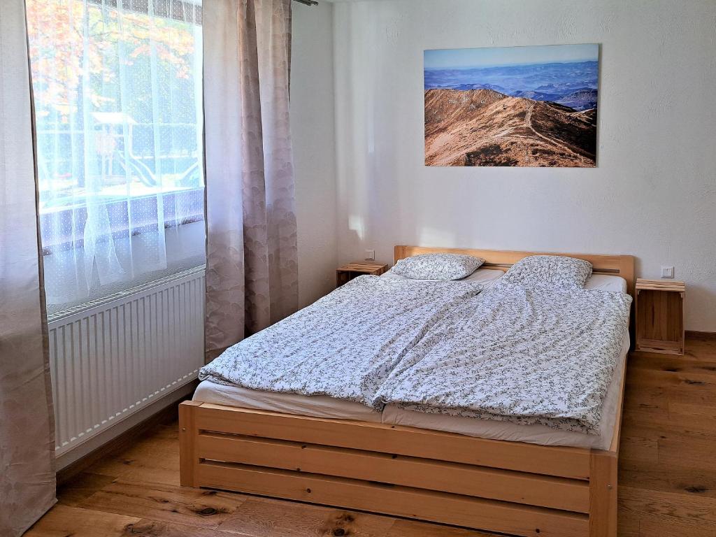 A bed or beds in a room at a4a Apartmán Mýto