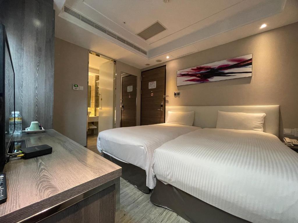 Postel nebo postele na pokoji v ubytování Royal Fine Hotel