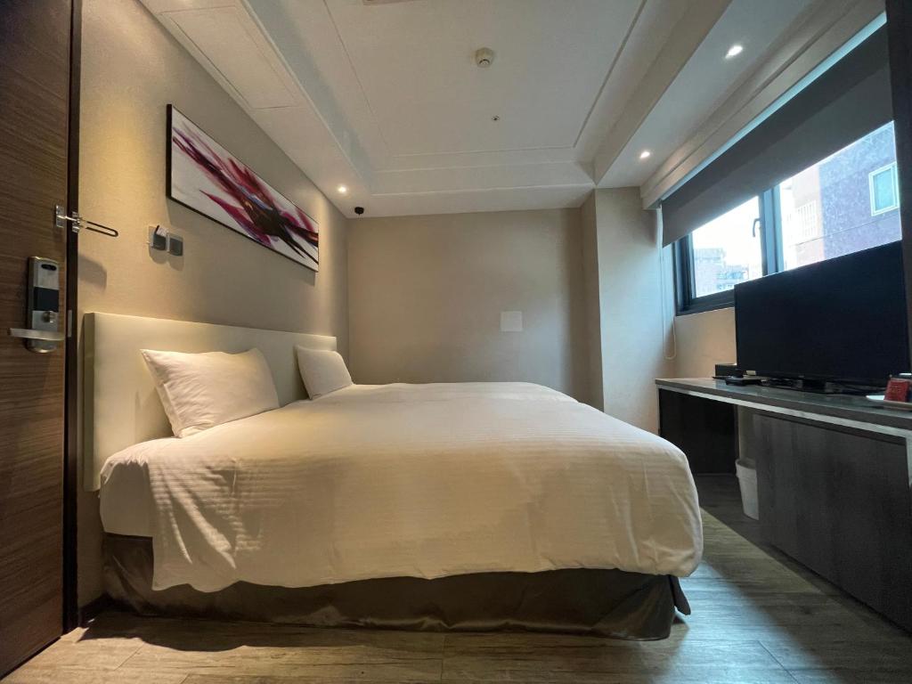 Postel nebo postele na pokoji v ubytování Royal Fine Hotel