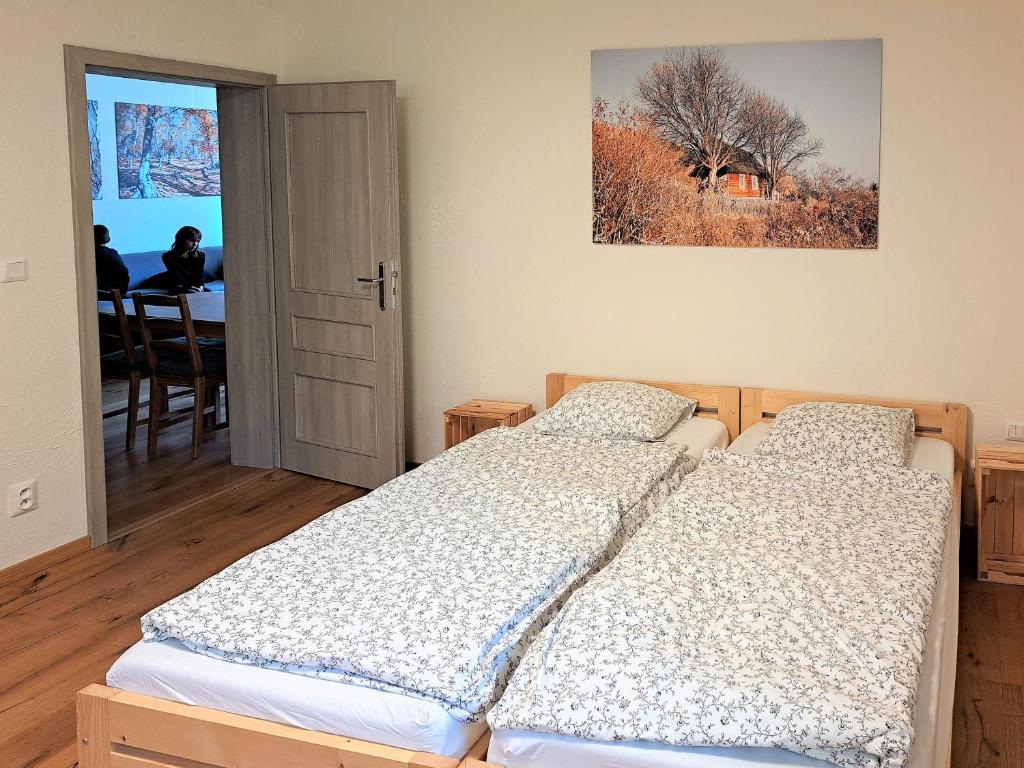 A bed or beds in a room at a4a Apartmán Mýto