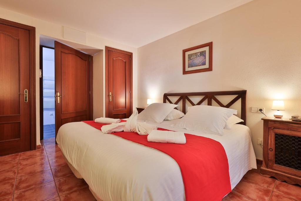 Postel nebo postele na pokoji v ubytování Hôtel Playa