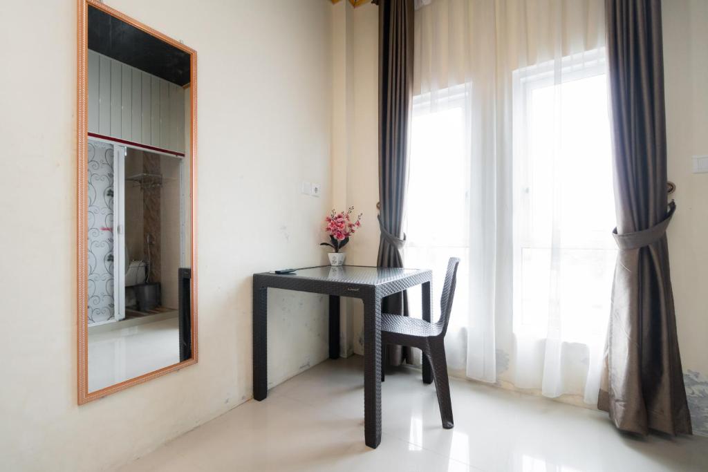 Fotografie z fotogalerie ubytování RedDoorz Syariah near Minangkabau International Aiport v destinaci Duku