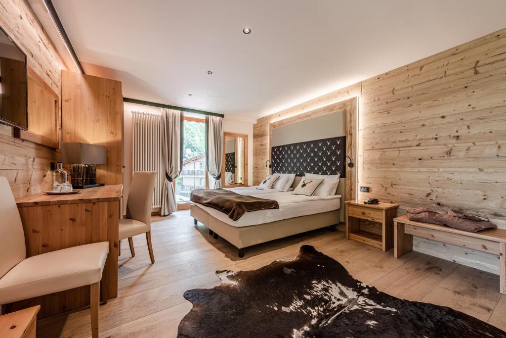 Postel nebo postele na pokoji v ubytování Boutique Hotel e Chalets Salvadori